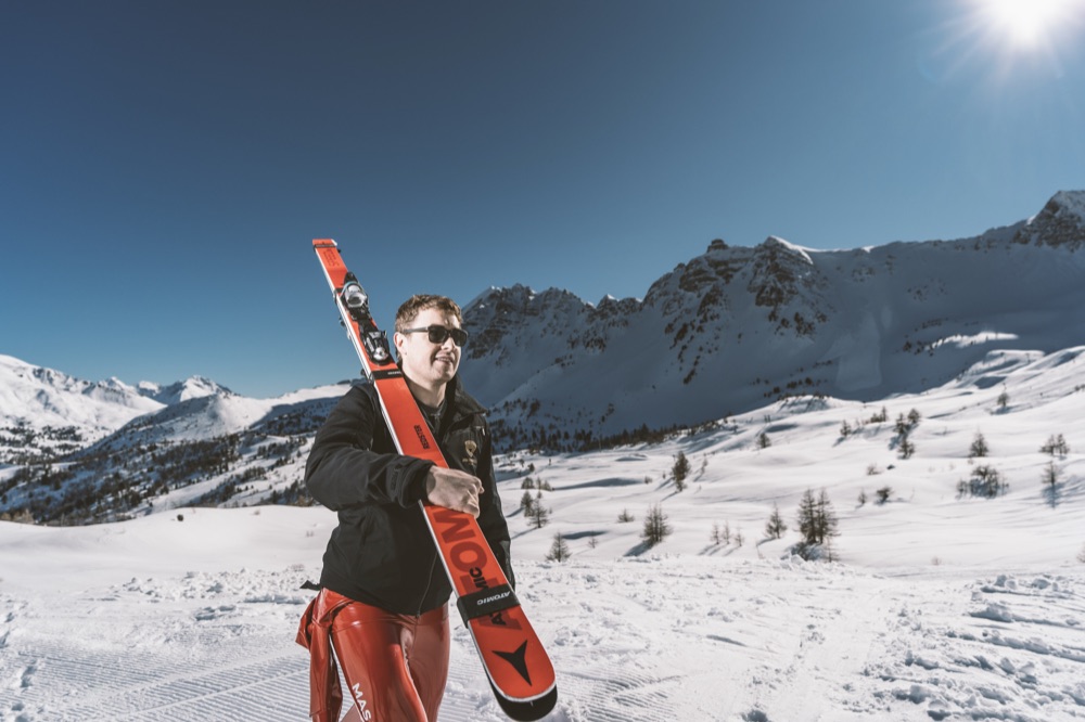 Jan Farrell carrying his speed skis at Vars